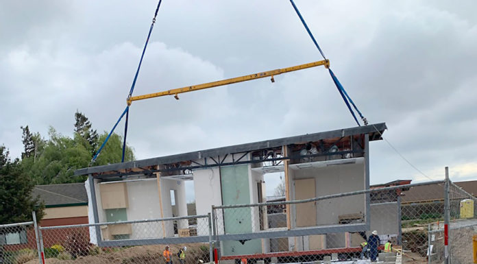 Crews assemble building for new womenās clinic in Soledad