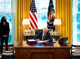 Biden signs stimulus bill ahead of prime-time address