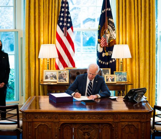 Biden signs stimulus bill ahead of prime-time address