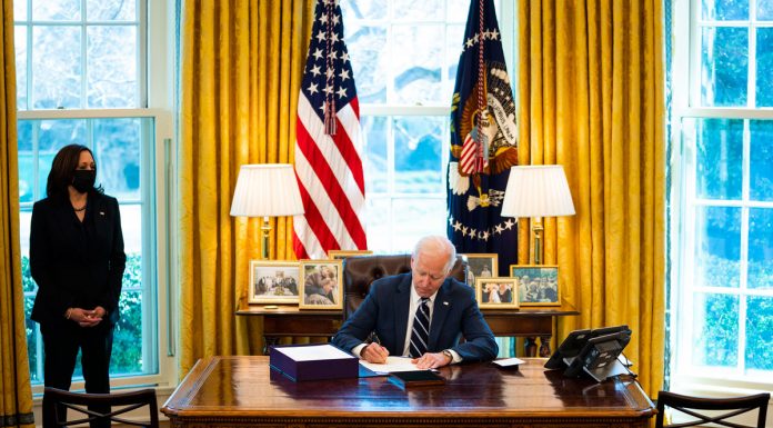 Biden signs stimulus bill ahead of prime-time address