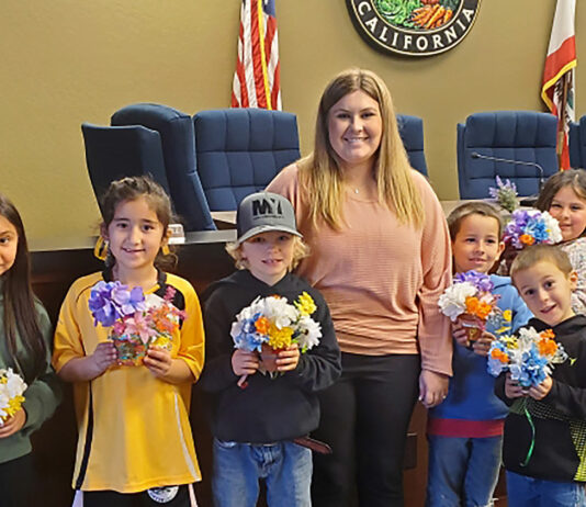 Gonzales and Soledad youth work on flower displays for upcoming fair