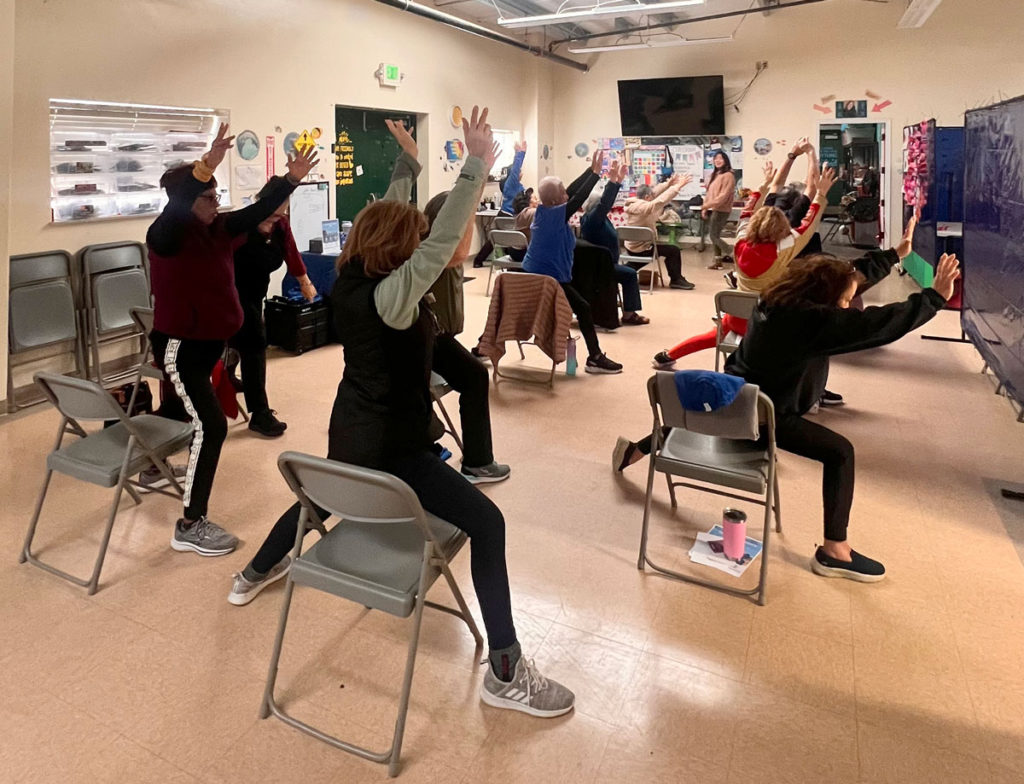 Image for display with article titled Gonzales residents take part in Chair Yoga