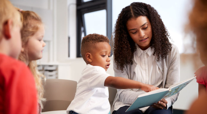 Only 1 in 6 homeless infants and toddlers enrolled in early childhood programs in California, study finds Child reading