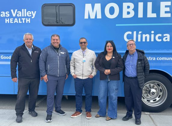 Salinas Valley Health leadership team in front of Mobile Clinic