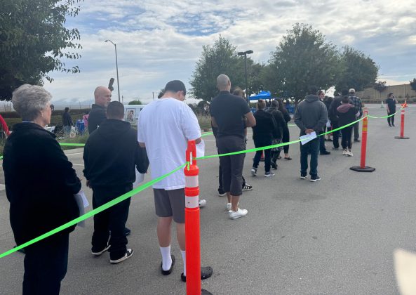 Residents wait in line for flu shots