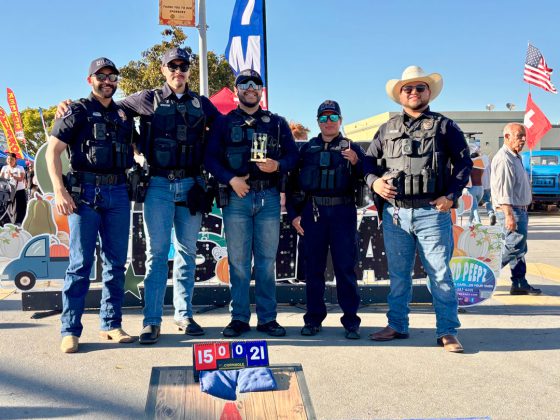 Officers at cornhole tournament