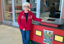 9th annual Greenfield Coat Drive gets underway Avelina Torres stands by coat donation bin