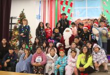 Nearly century-old candy tradition lives on in Gonzales Gonzales students with Santa