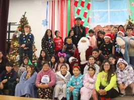 Nearly century-old candy tradition lives on in Gonzales Gonzales students with Santa
