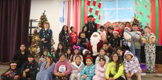 Nearly century-old candy tradition lives on in Gonzales Gonzales students with Santa