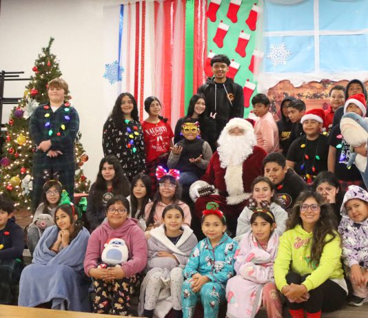 Nearly century-old candy tradition lives on in Gonzales Gonzales students with Santa