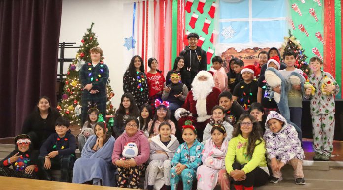 Nearly century-old candy tradition lives on in Gonzales Gonzales students with Santa