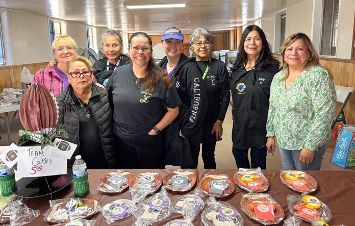 Club members with football-themed baked goods
