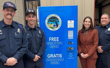 Officials with Naloxone and fentanyl test strip kiosk
