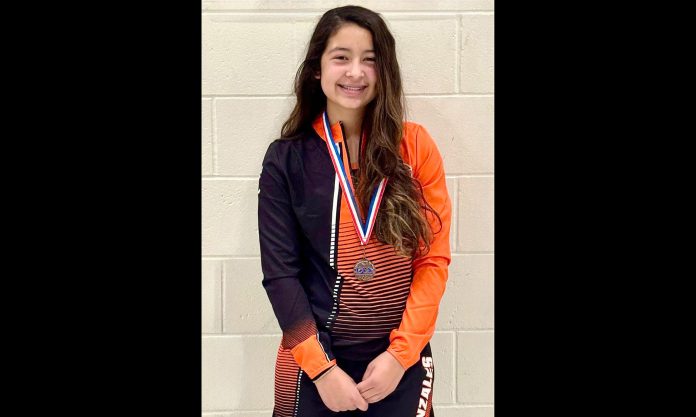 Gonzales wrestler with medal