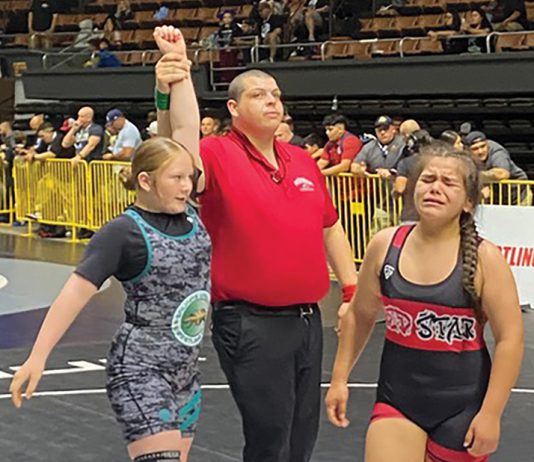 Gonzales middle-school wrestler wins state title Gonzales wrestler hand raised after winning