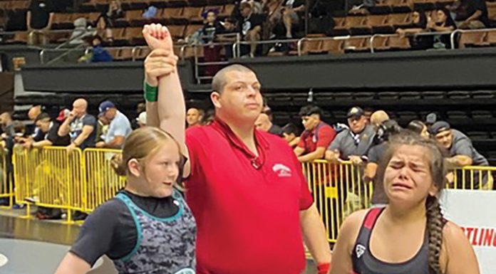 Gonzales middle-school wrestler wins state title Gonzales wrestler hand raised after winning