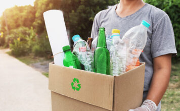 woman hand holding box garbage for recycle