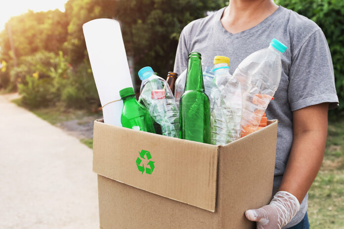 woman hand holding box garbage for recycle