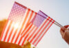 Salinas Valley cities prepare for 4th of July celebrations Woman holding USA flag celebrating Independence Day