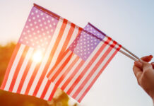 Salinas Valley cities prepare for 4th of July celebrations Woman holding USA flag celebrating Independence Day