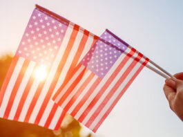 Salinas Valley cities prepare for 4th of July celebrations Woman holding USA flag celebrating Independence Day