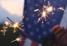 Cal Fire, local partners unite to promote fireworks safety Hand holding sparkler fireworks