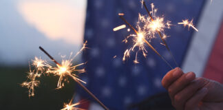 Cal Fire, local partners unite to promote fireworks safety Hand holding sparkler fireworks