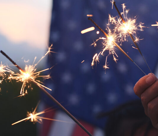 Cal Fire, local partners unite to promote fireworks safety Hand holding sparkler fireworks