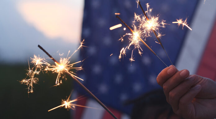 Cal Fire, local partners unite to promote fireworks safety Hand holding sparkler fireworks
