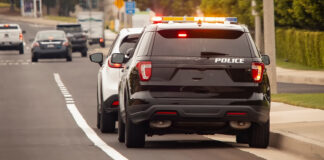 Speeding crackdown set for this summer in South Monterey County Behind view of a police car that pulled a motorist over to the side of the road