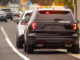 Behind view of a police car that pulled a motorist over to the side of the road