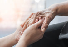 Alzheimer’s Association expands outreach in South Monterey County this fall Parkinson disease patient, Alzheimer elderly senior, Arthritis person hand in support of nursing family caregiver care for disability awareness day