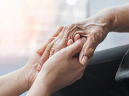 Alzheimer’s Association expands outreach in South Monterey County this fall Parkinson disease patient, Alzheimer elderly senior, Arthritis person hand in support of nursing family caregiver care for disability awareness day