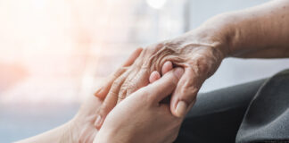 Alzheimer’s Association expands outreach in South Monterey County this fall Parkinson disease patient, Alzheimer elderly senior, Arthritis person hand in support of nursing family caregiver care for disability awareness day