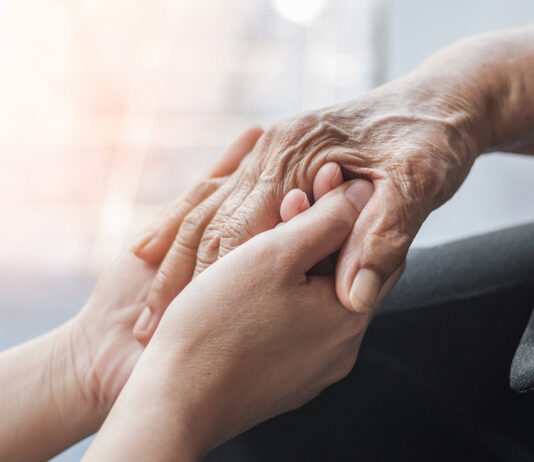 Alzheimer’s Association expands outreach in South Monterey County this fall Parkinson disease patient, Alzheimer elderly senior, Arthritis person hand in support of nursing family caregiver care for disability awareness day