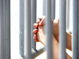 Federal grant extends youth violence prevention program in Monterey County Hands Grasping Metal Bars in Light