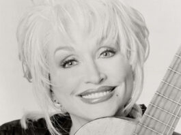 Give Like Dolly Day to support children’s literacy on Sept. 25 Dolly Parton with guitar