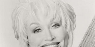 Give Like Dolly Day to support children’s literacy on Sept. 25 Dolly Parton with guitar