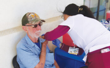 Man gets flu shot at Salinas Valley Health flu clinic