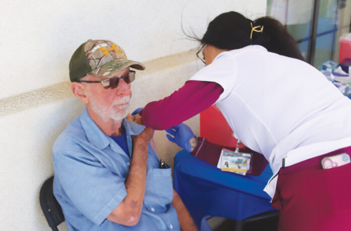 Jerry Cornwell gets flu shot Man gets flu shot at Salinas Valley Health flu clinic
